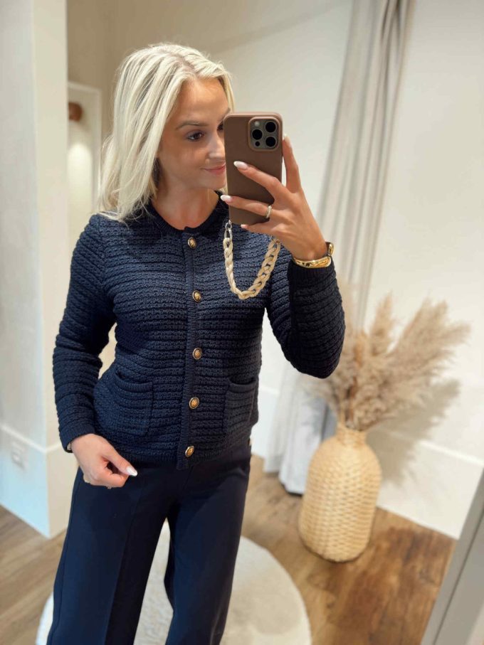 Gilet navy gouden knopen.