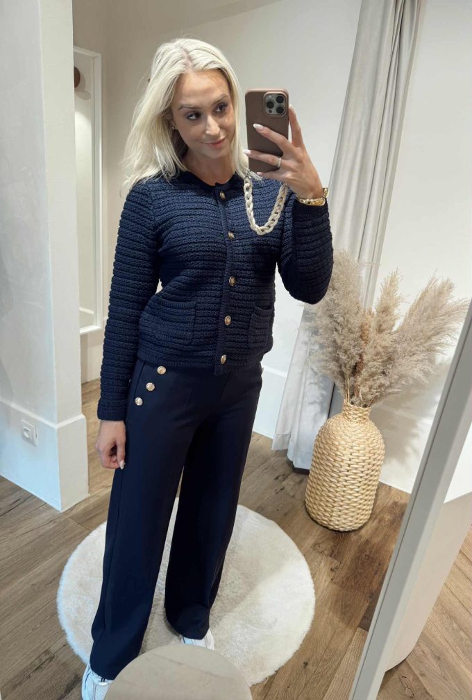 Gilet navy gouden knopen.